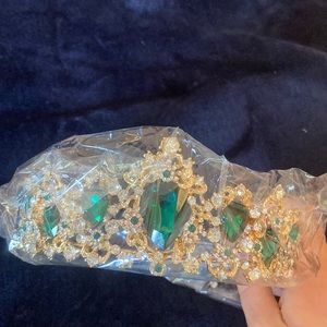 Gold tiara with emerald gems